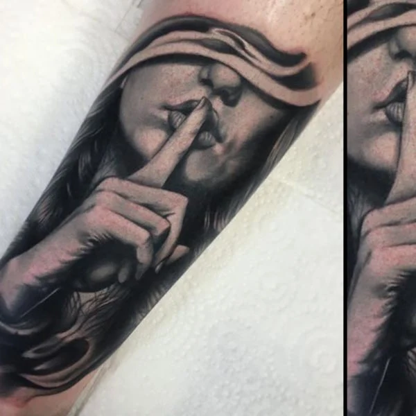 Black and grey portrait tattoo of a woman holding a finger to her lips.